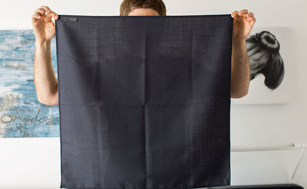 A person holding the Shepherd's Wool Utility Cloth.